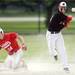 Milan High School second baseman freshman Zachary Allen looks for a double play as Coldwater High School baserunner, freshman Brendan Spangler looks on after being tagged out during the second inning of the MHSAA baseball quarterfinals at Nichols Field at Bailey Park in Battle Creek on Tuesday, June 11, 2013. Melanie Maxwell | AnnArbor.com